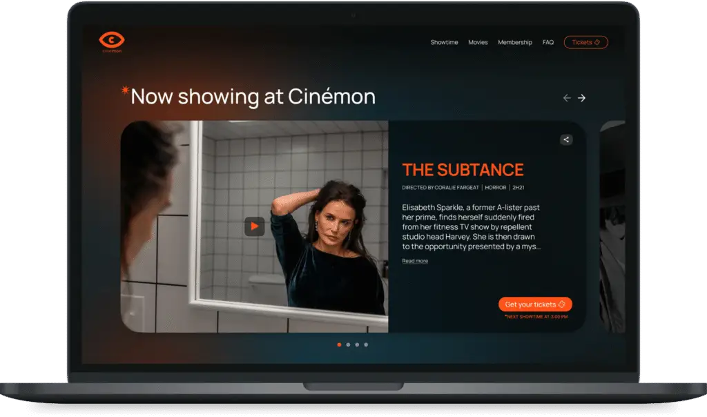 Responsive web design of a cinema platform on a laptop screen, showcasing a horror movie with description and ticket purchase button.